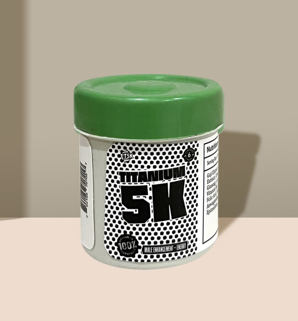 A plastic jar labeled "Titanium 5K" with green lid and text detailing male enhancement benefits