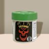 Green-capped Ultimo pill bottle with skull graphic and nutrition label.