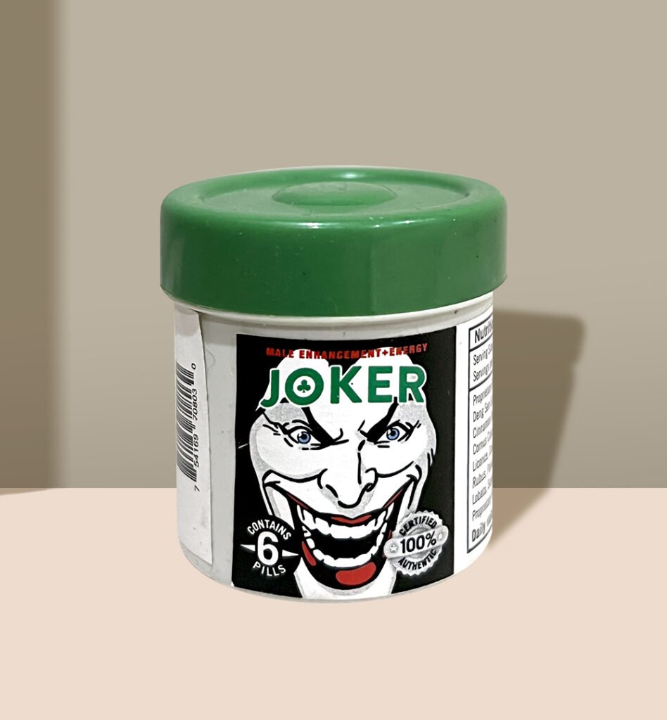 Green-capped Joker pill bottle with 'Male Enhancement + Energy' label