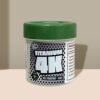 Green-capped Titanium 4K pill bottle with comic-style label